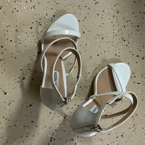 4 inch white patent leather heels. Zipper in back. Worn once. Dynamite looking!